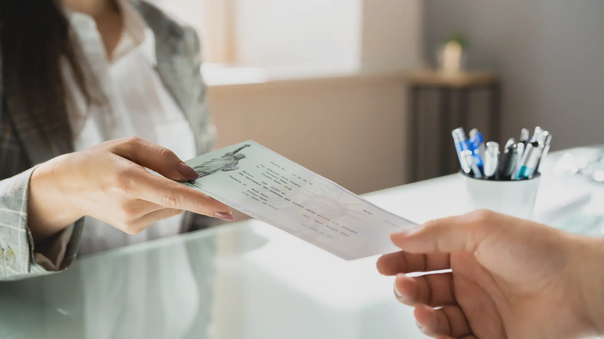 woman getting paid out - Are Class Action Settlements Taxable