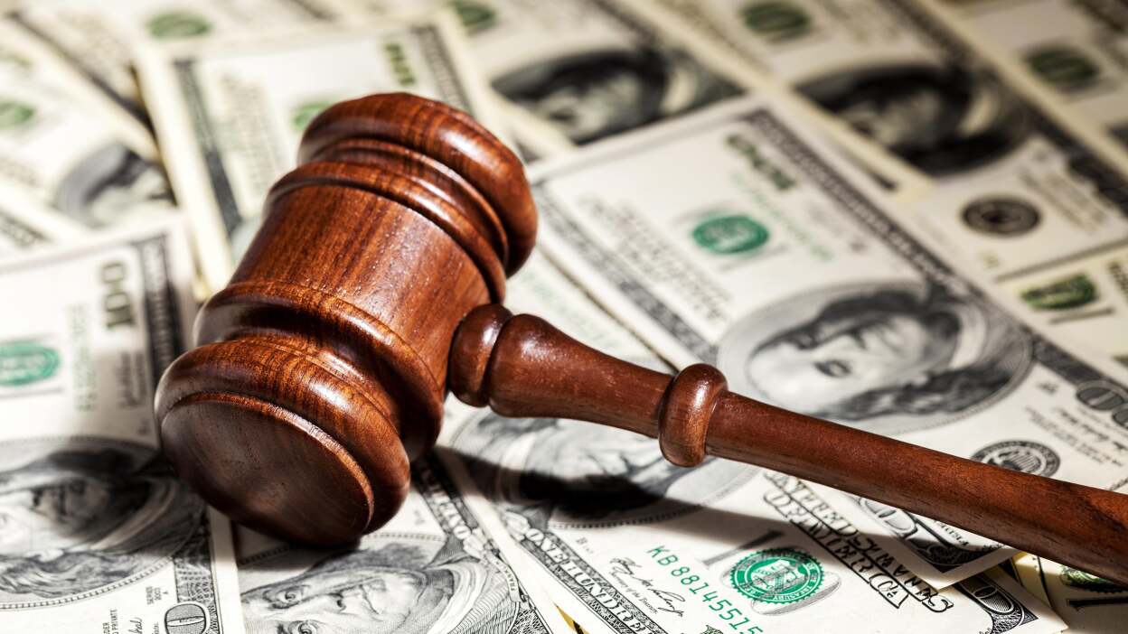 money with gavel - What Is A Class Action Settlement